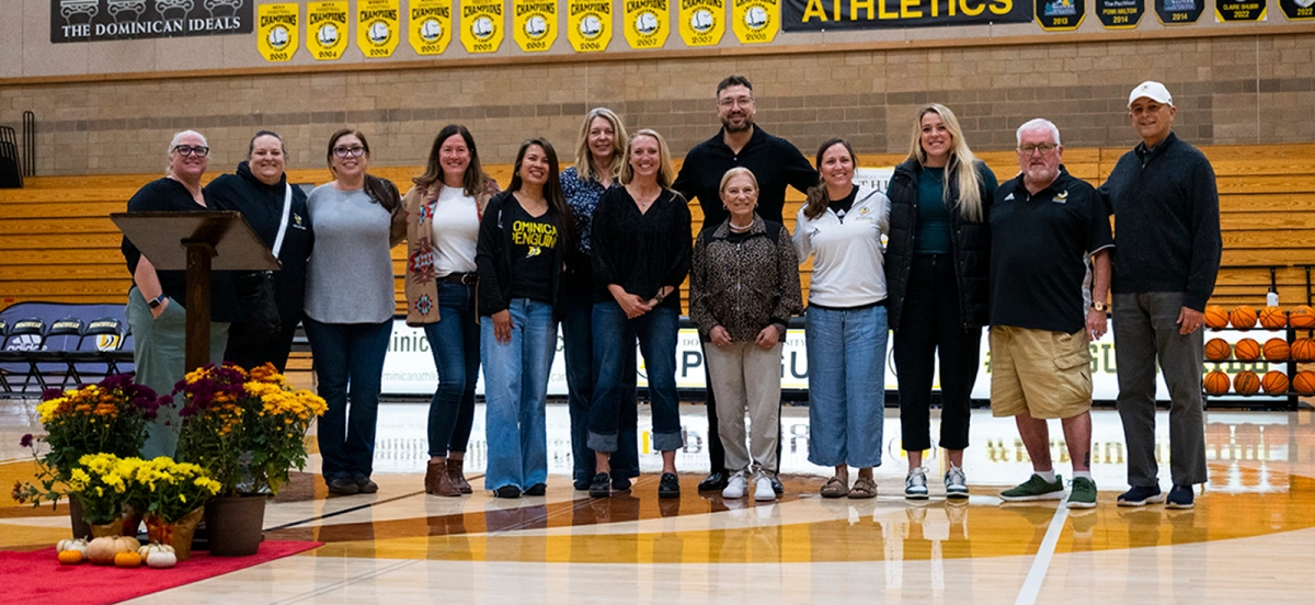 Dominican hall of fame inductees pose for a photo in Conlan Center gym.