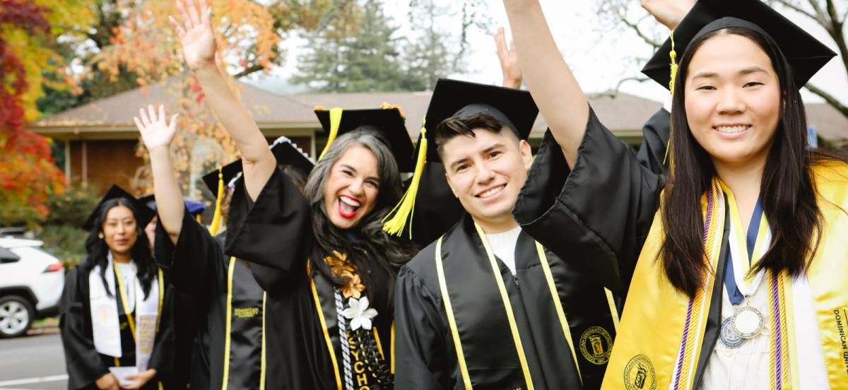 graduates cheering and celebrating