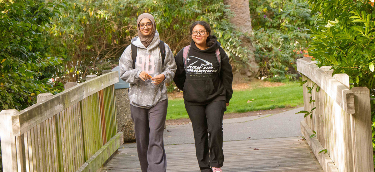 Two female students walking together on the Dominican campus.