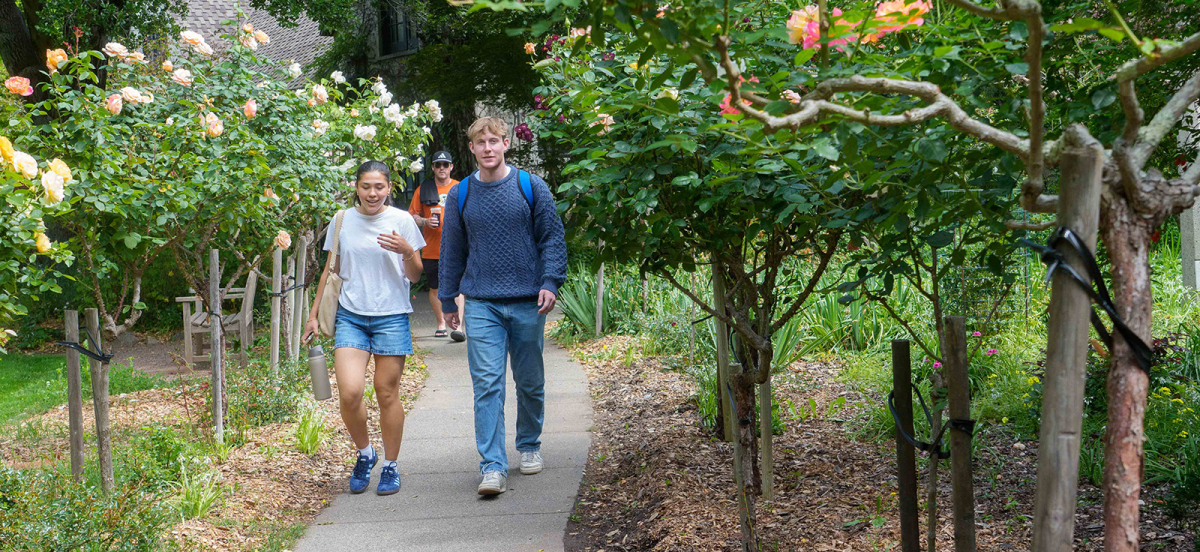 students walking through rose garden at Dominican campus