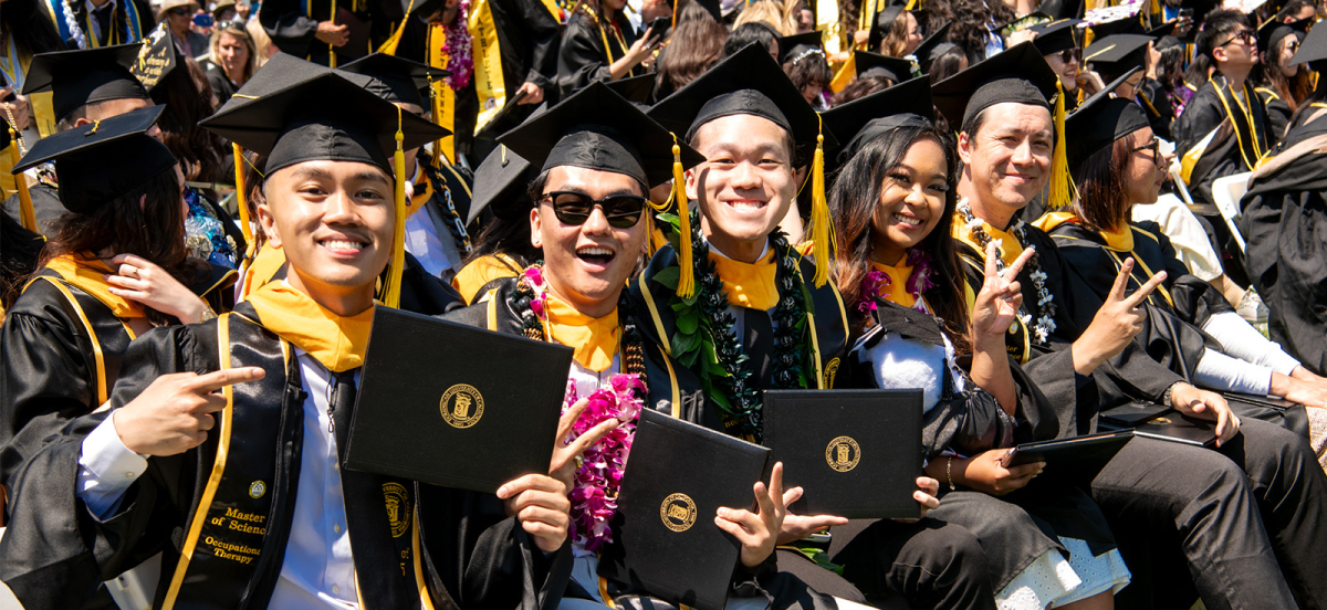 6 graduating students at commencement ceremony 