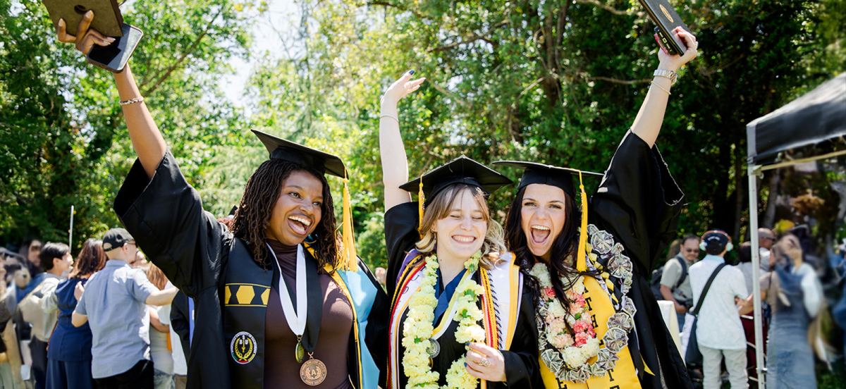 Students celebrating at their graduation.