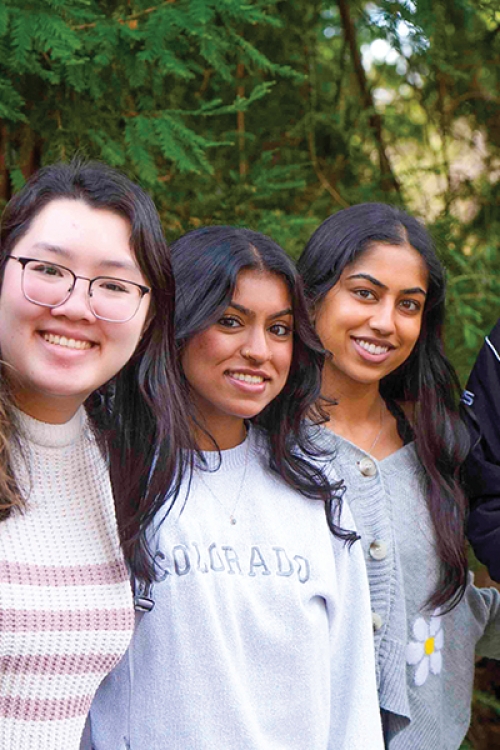 Student group facing camera and smiling