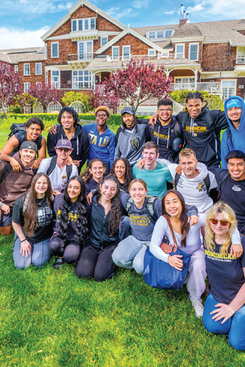students gathered in front of meadowlands hall. 2 U.S. News badges from 2026 displayed