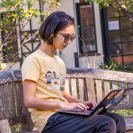 student using laptop computer