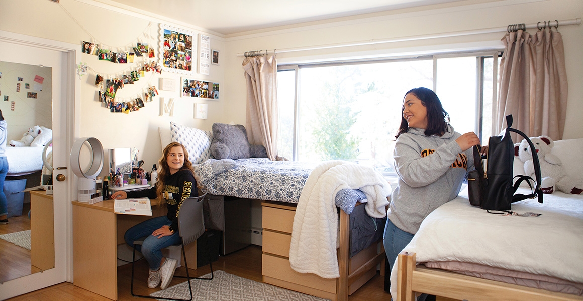 two student residents in their housing unit