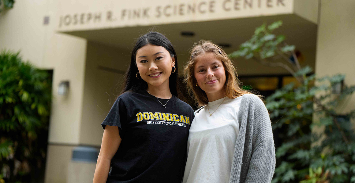 Two female undergraduate students stand outside the Fink Science Center on the Dominican campus.