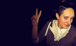 image of Dominican alumna Kat Skiles '07 flashing peace sign