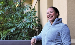 A female student smiles at the camera