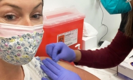 Photo of Michaela George receiving COVID-19 vaccine 