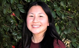 Head shot photo of OT graduate student Lucy Chen in front of ivy