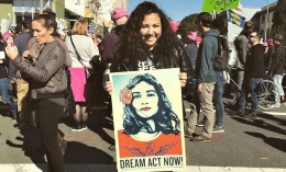 Photo of Salma Abdulkader Holding "Dream Act Now: Soon At Community Rally/Protest