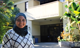 female student standing in front of Science Center at Dominican University of California