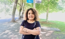 Connie Bustinza posing for photo on Dominican University of California's campus