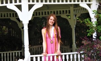 Photo of Olivia Lang-Brown posing inside white gazebo for HP image