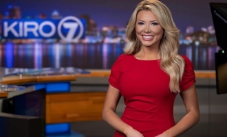 Photo of Frankie Katafias in red dress posing on set of KIRO TV in Seattle as new morning weather anchor