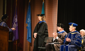 Dr. Jennifer Lucko from Dominican's Education Department accepting the Fink Faculty Award 2025