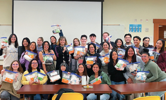Dominican University of California nursing students pose for a photo inside the classroom.