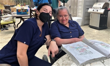 Occupational Therapy student Amie Smith '23 (left) working with patient in ABLE program 