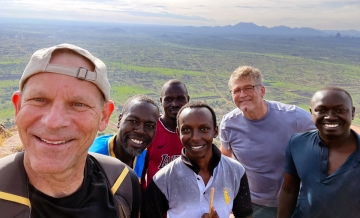 Dr. Roland Cooper with malaria research team in Uganda 2023