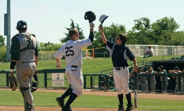 two baseball players celebrate on the field 