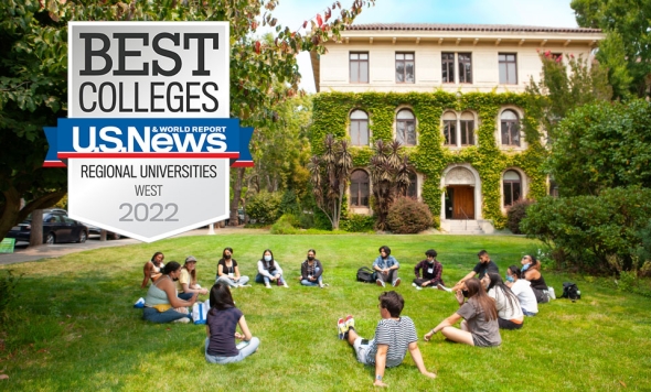 Photo of students sitting circled on Guzman Hall lawn with green ivy adorning building's walls in background with `Best Colleges U.S. News" graphic badge inserted on left  