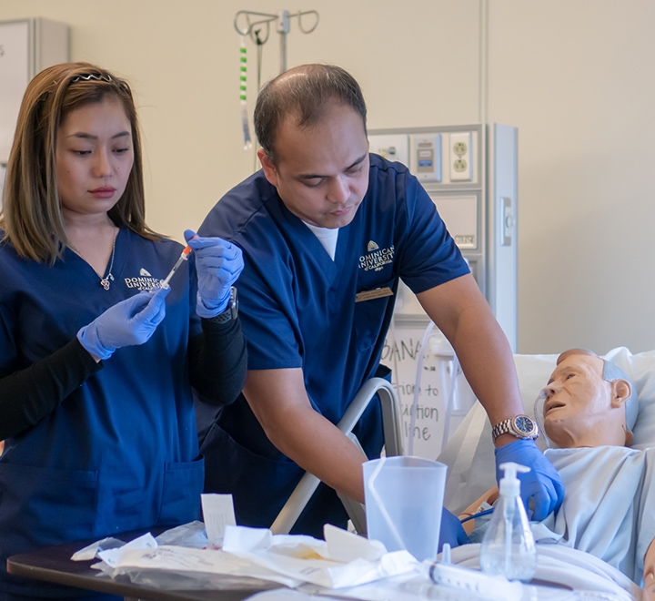 Two students in Dominican's nursing simulation lab.