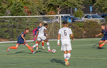 Dominican University students playing soccer