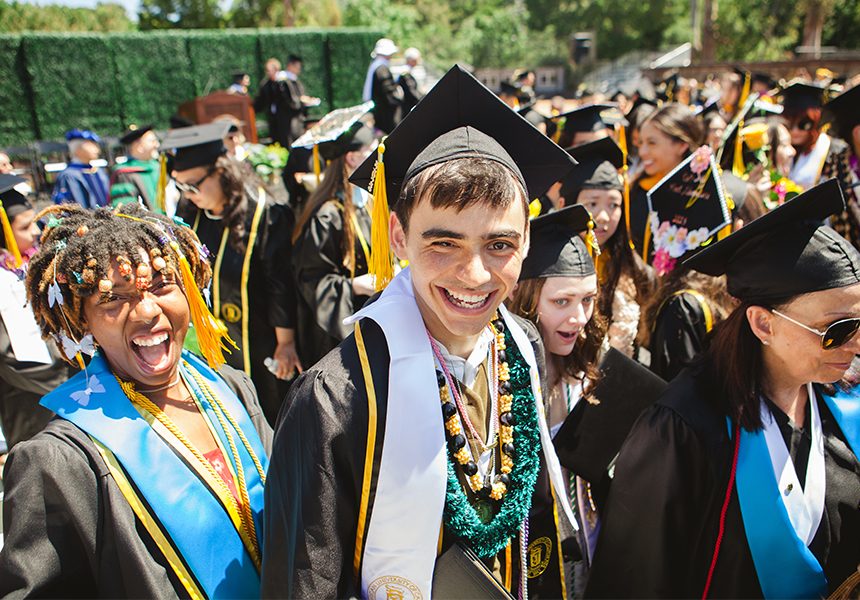 student smiling after graduating
