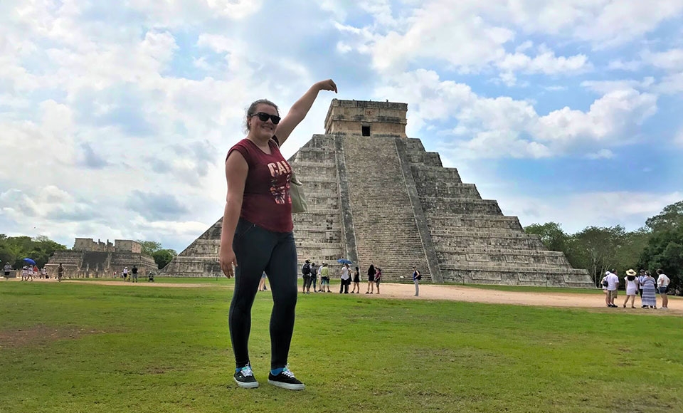 dominican student in front of pyramid in mexico