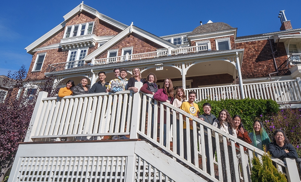 Students stand on the stairs of Meadowlands Hall on the Dominican University of California campus