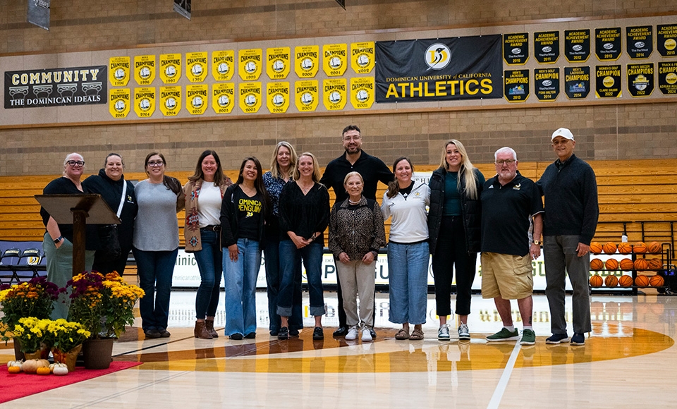 A group of Dominican Athletics Hall of Fame 2025 inductees pose together for a photo in Conlan Center.